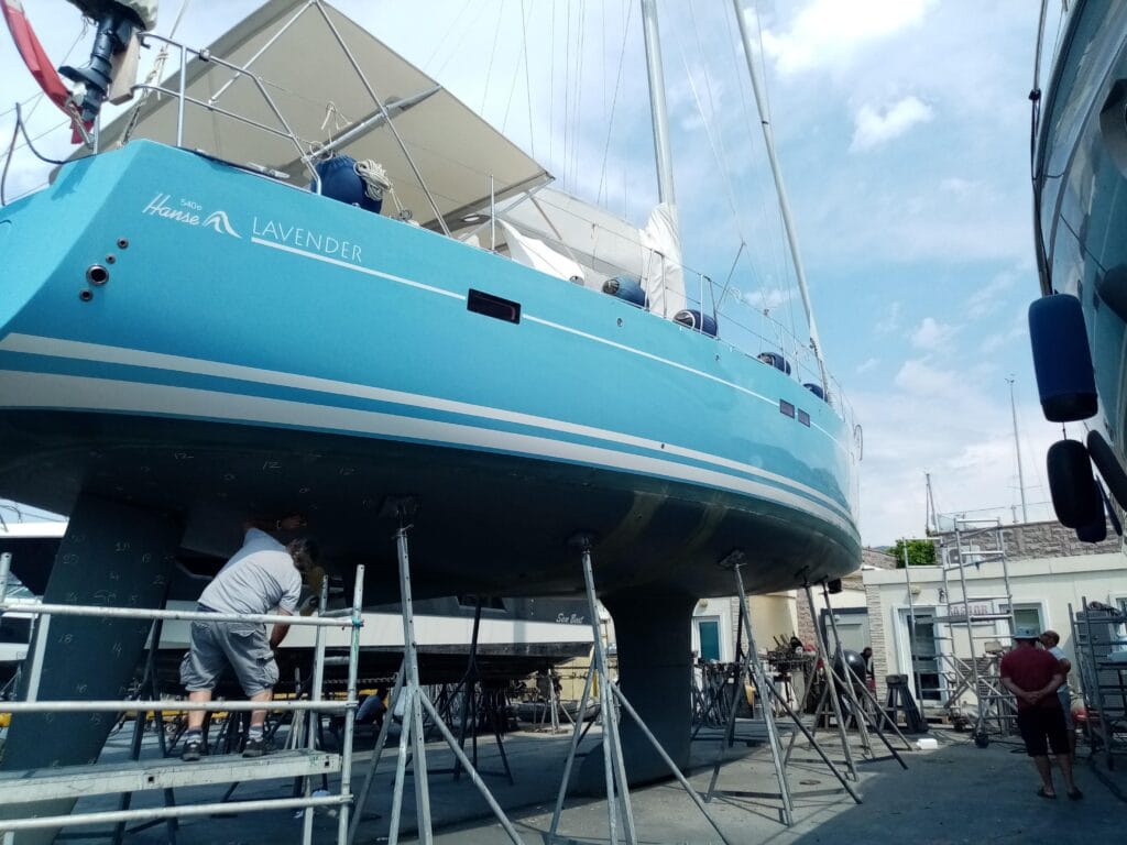 Hanse sailing yacht blocked on yard stands during a marine survey haul out inspection